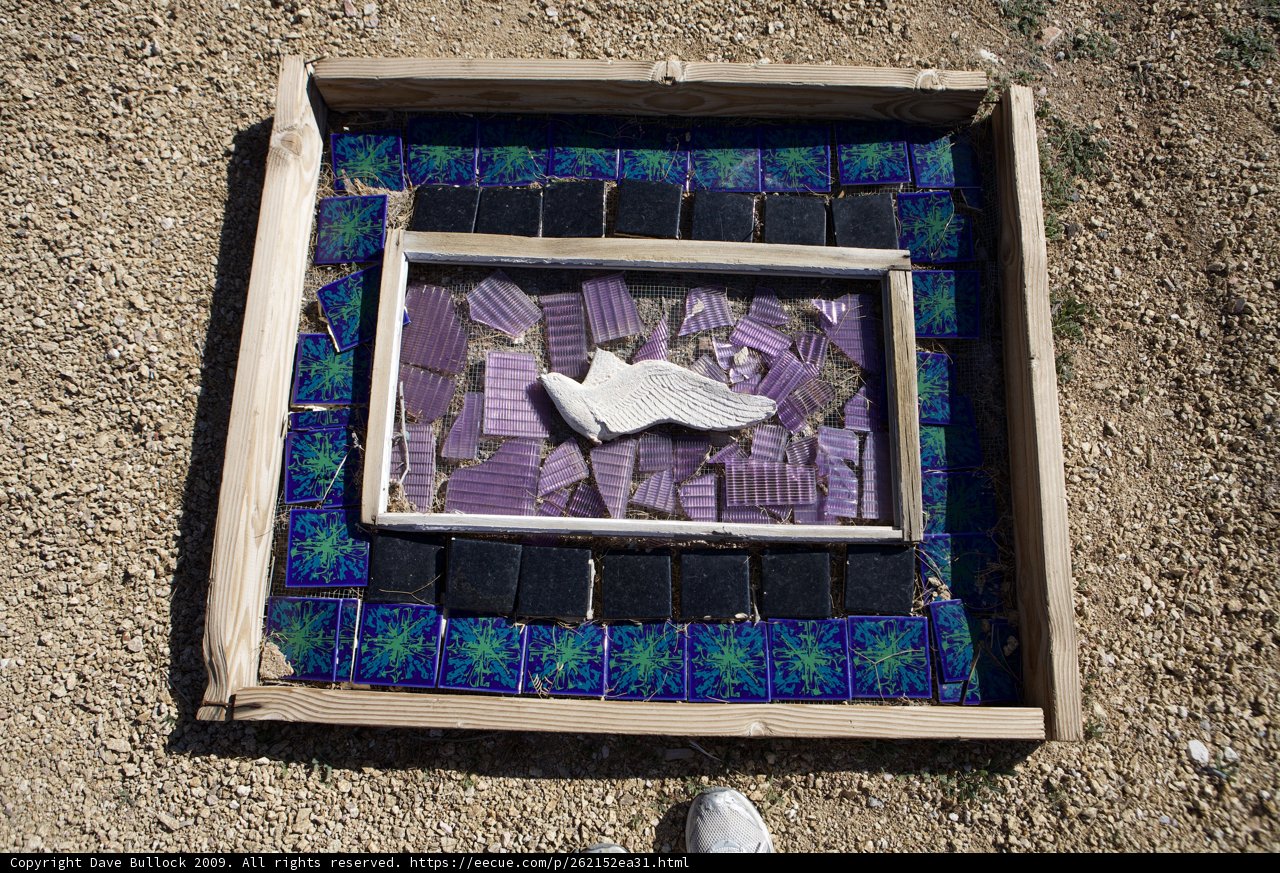 Shoe Art Displayed on Wooden Frame