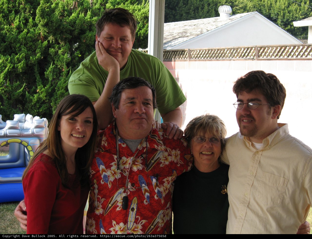 Family Christmas Gathering in Backyard Setting