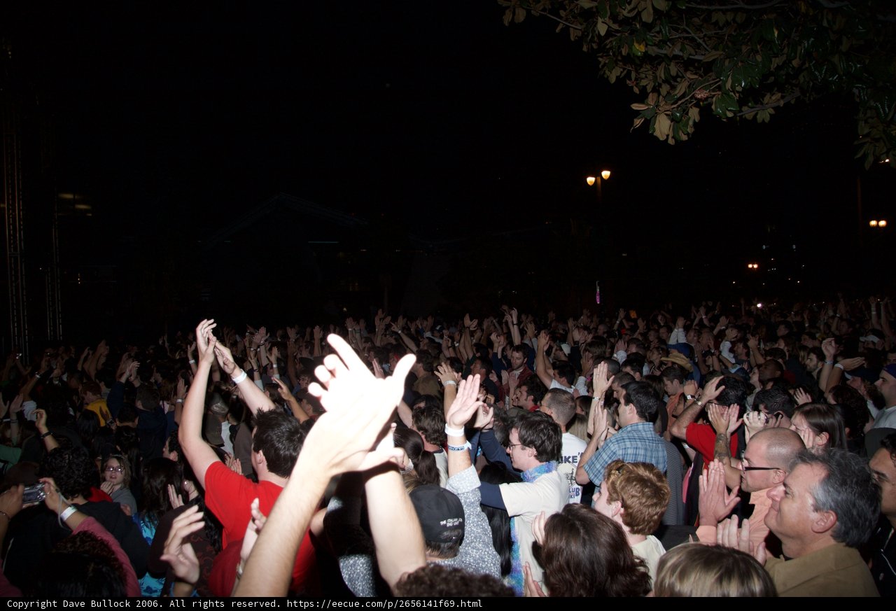 Electric Night Sky: A Crowd's Uplifting Joy at a Concert