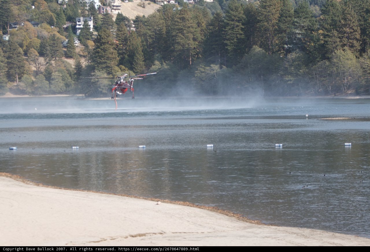 Helicopter Flying over Lake