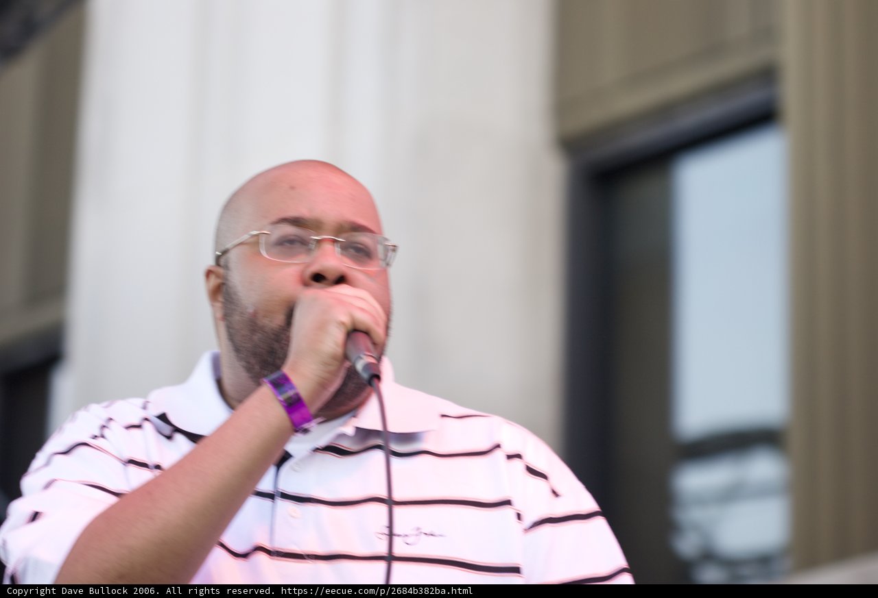Gift of Gab performing with glasses and microphone