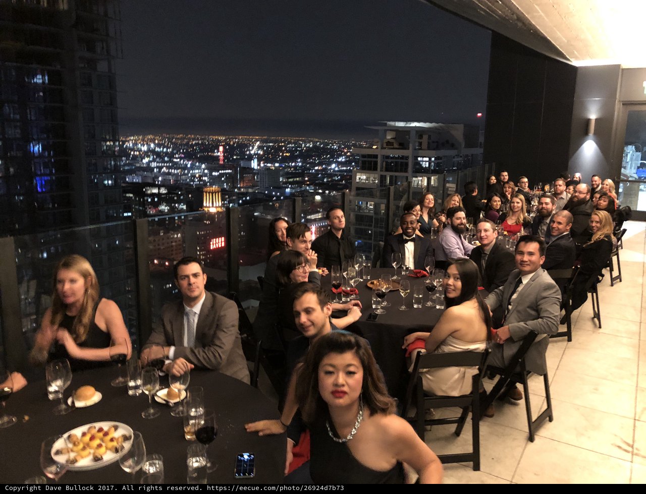Elegant Rooftop Gala Dinner with City Skyline