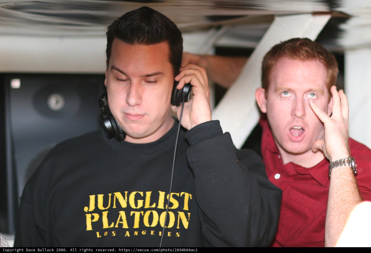 Black-Shirted Man Listening to Music