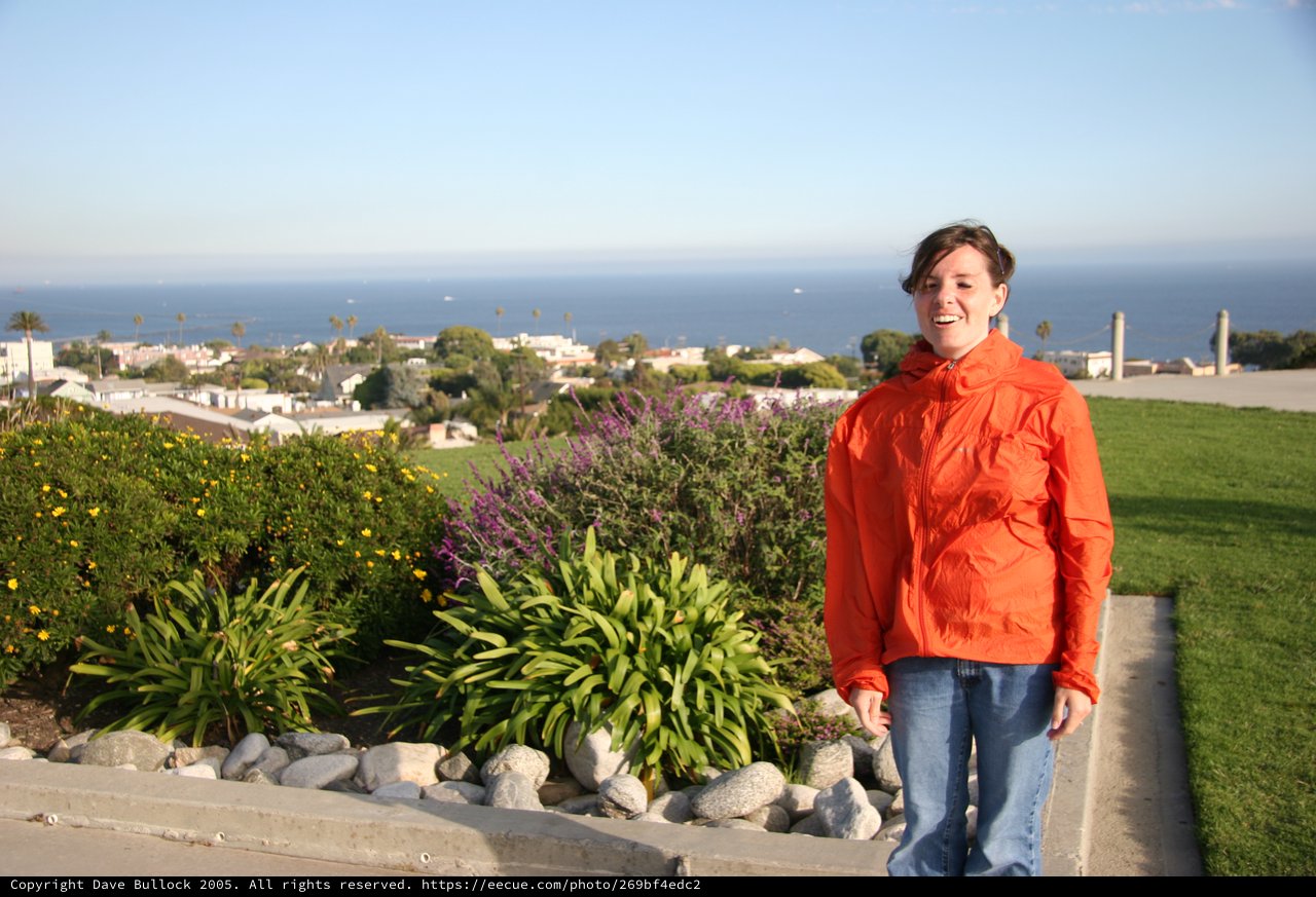 Smiling Woman Overlooking Coastal California Town