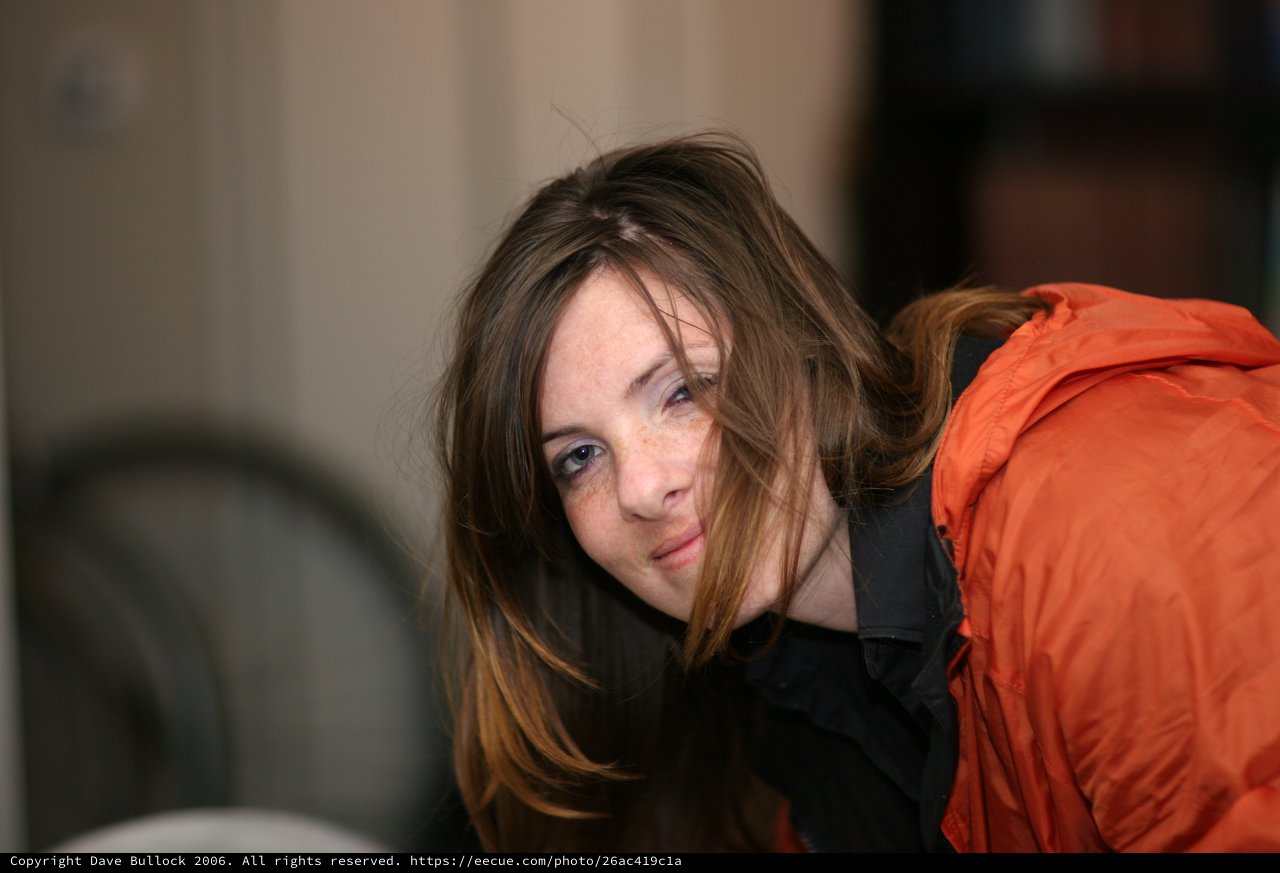 Candid Portrait of Young Woman in Orange Jacket