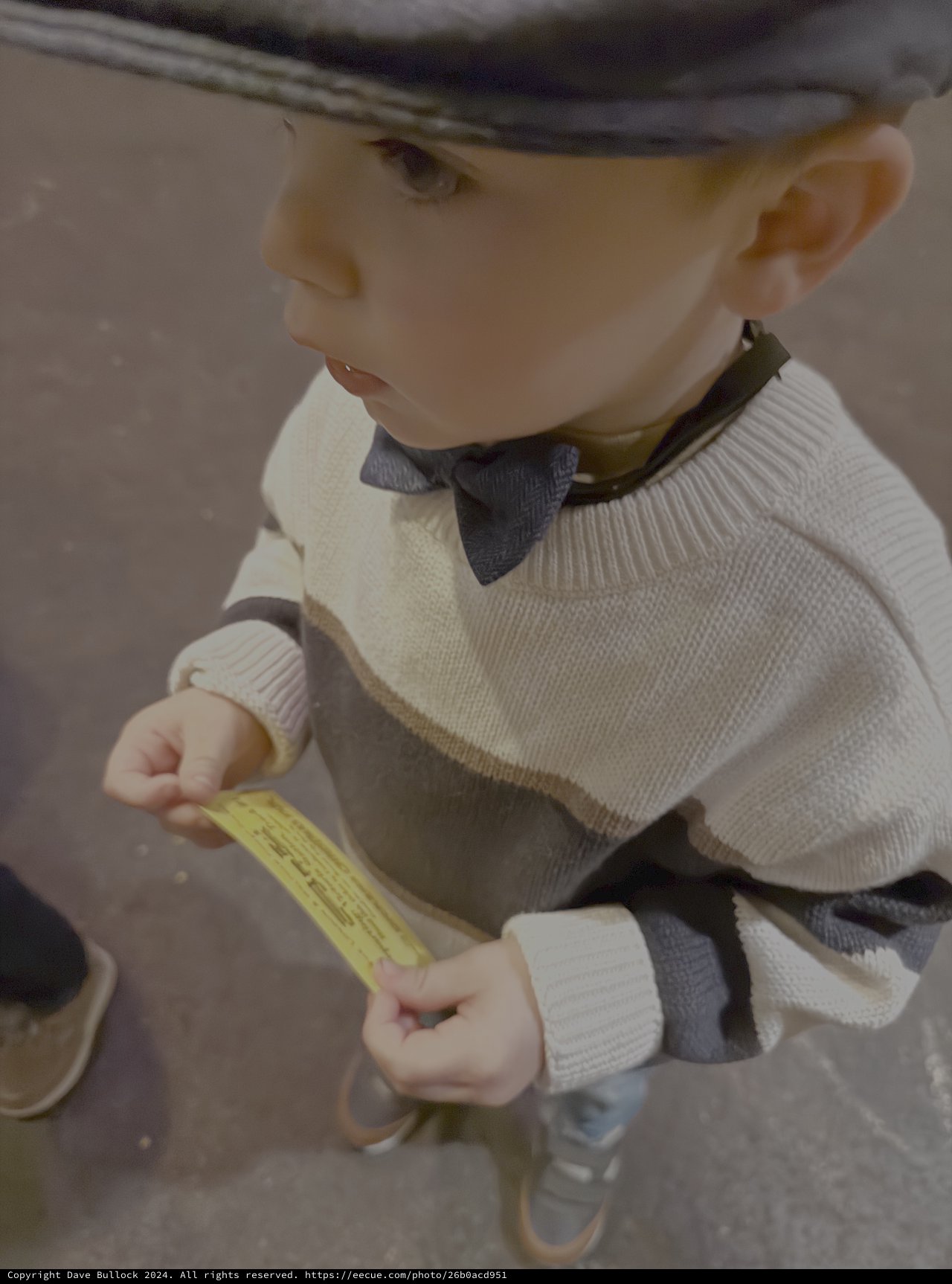 Child Reading Yellow Paper Outdoors