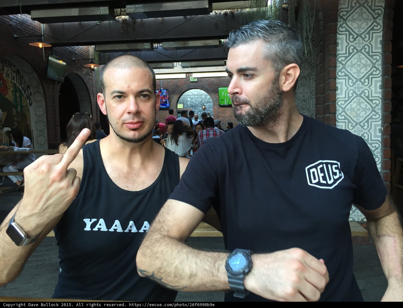 Two Men in Black Shirts Working Out Together