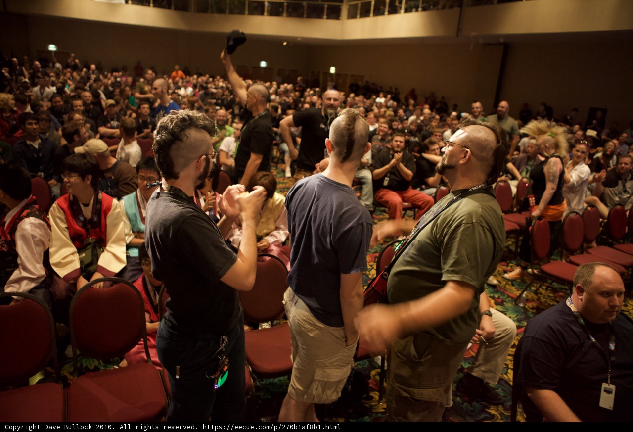 One Man Stands Out in a Packed Auditorium