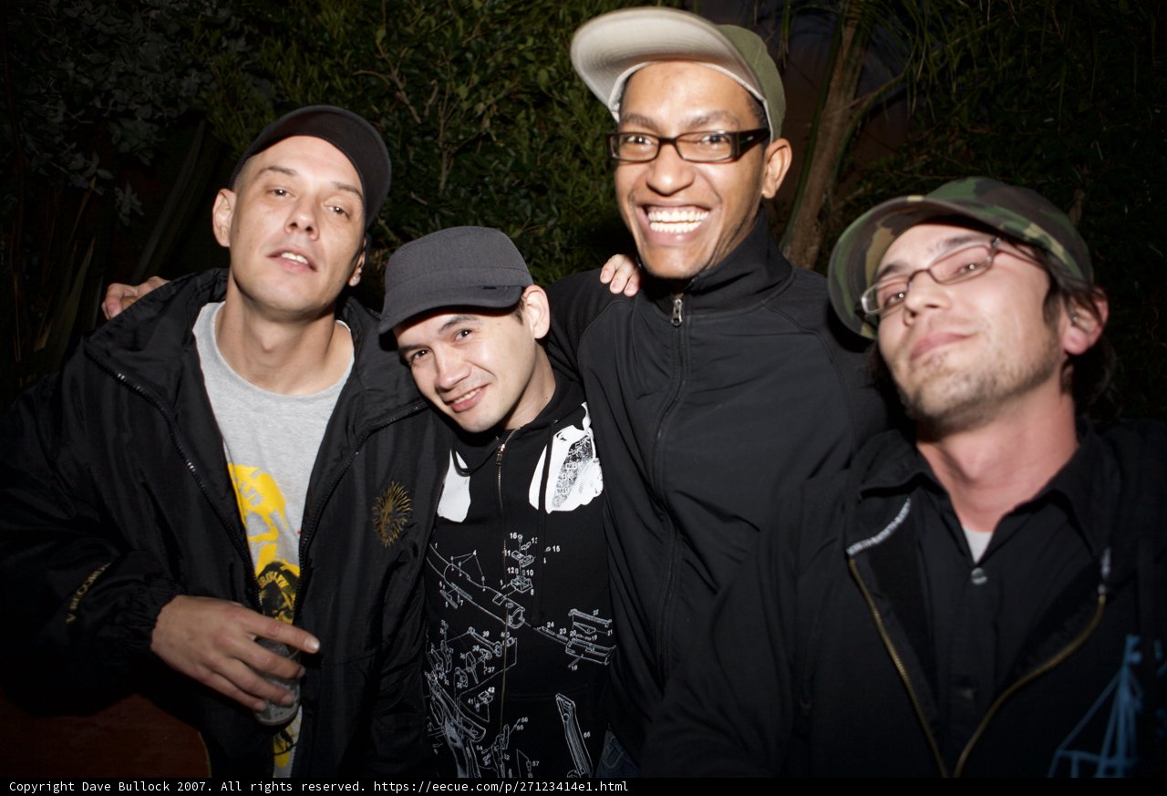 Four Men Strike a Pose