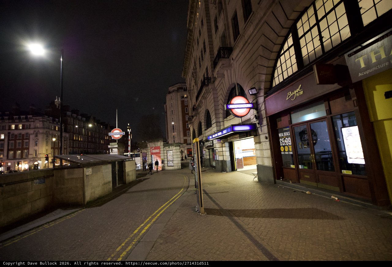 Empty London Street at Night with Underground Station