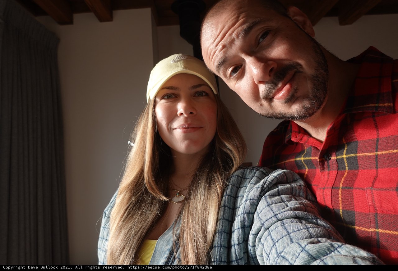 Happy Couple Taking Indoor Selfie Together