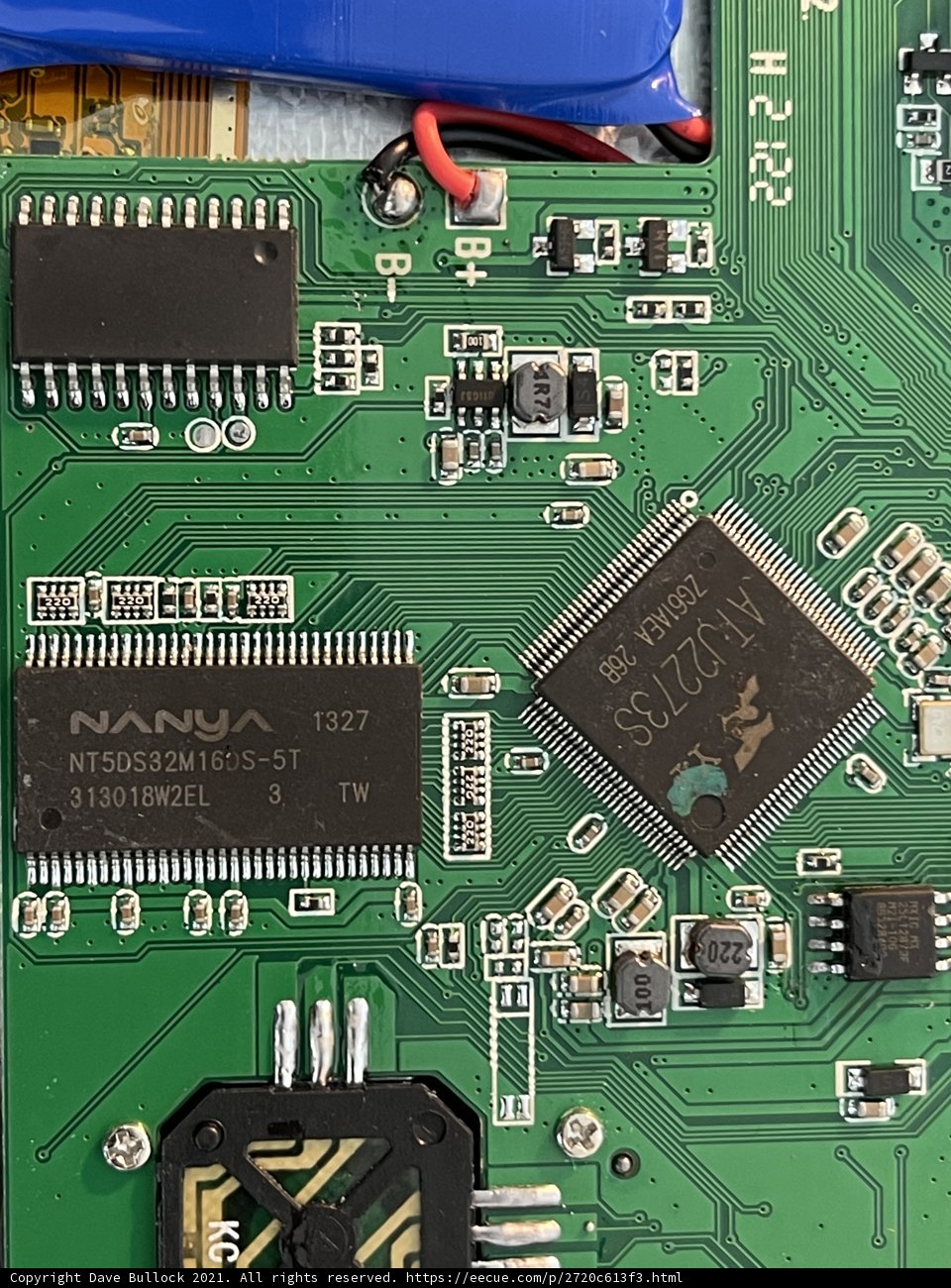 Inside the Machine: A Close-Up of a Motherboard with Battery and Charger