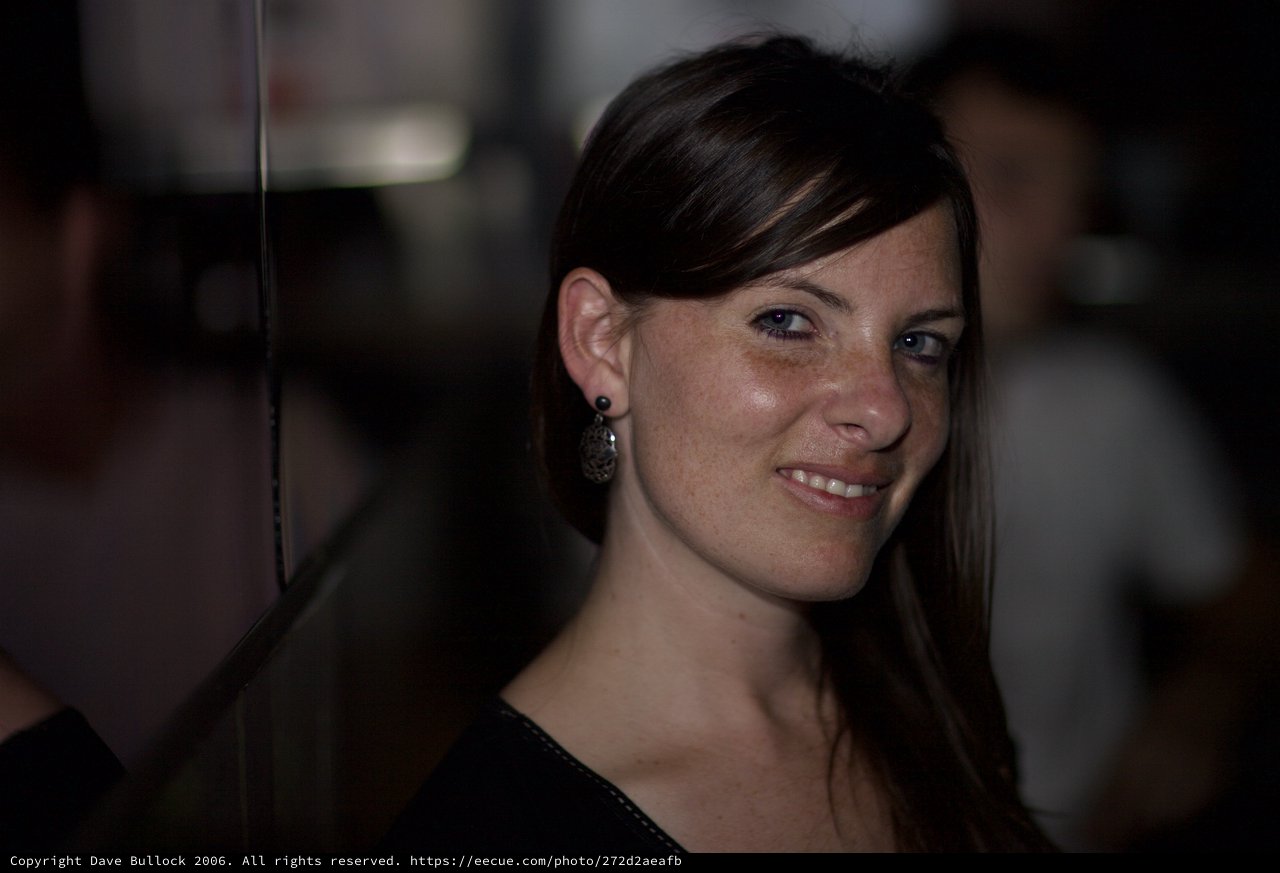 Penelope's Warm Smile in Dim Evening Light