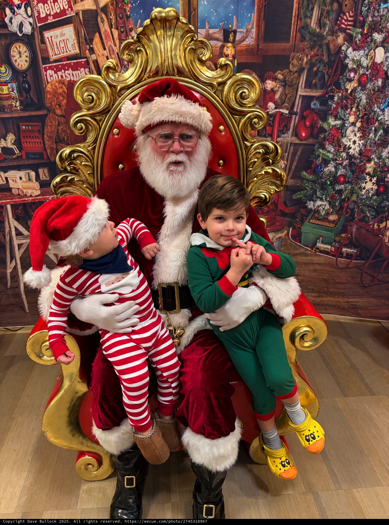 Two Children Visit Santa in His Ornate Golden Throne