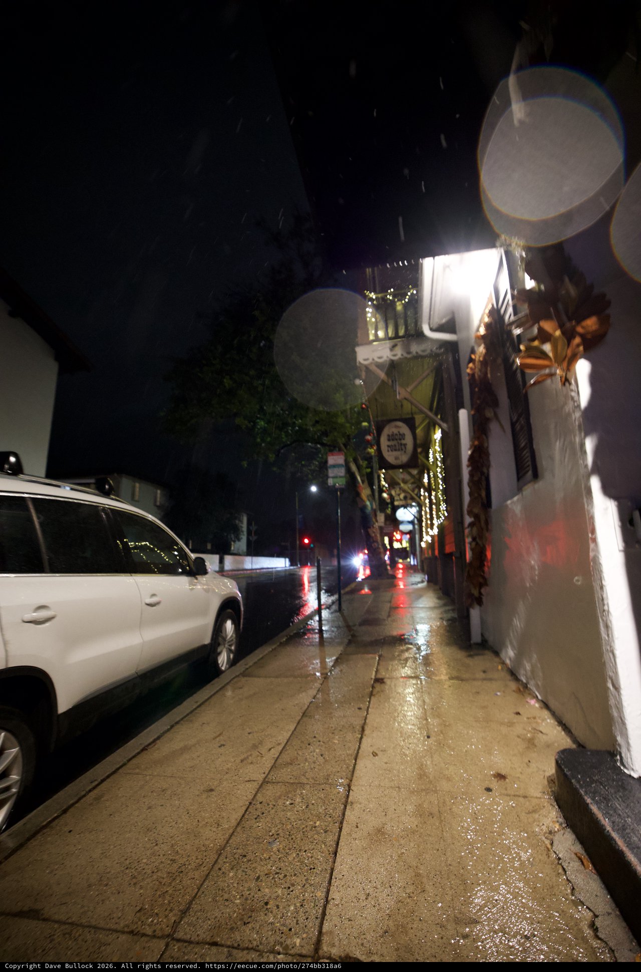 Rainy Night on a Quiet Urban Sidewalk