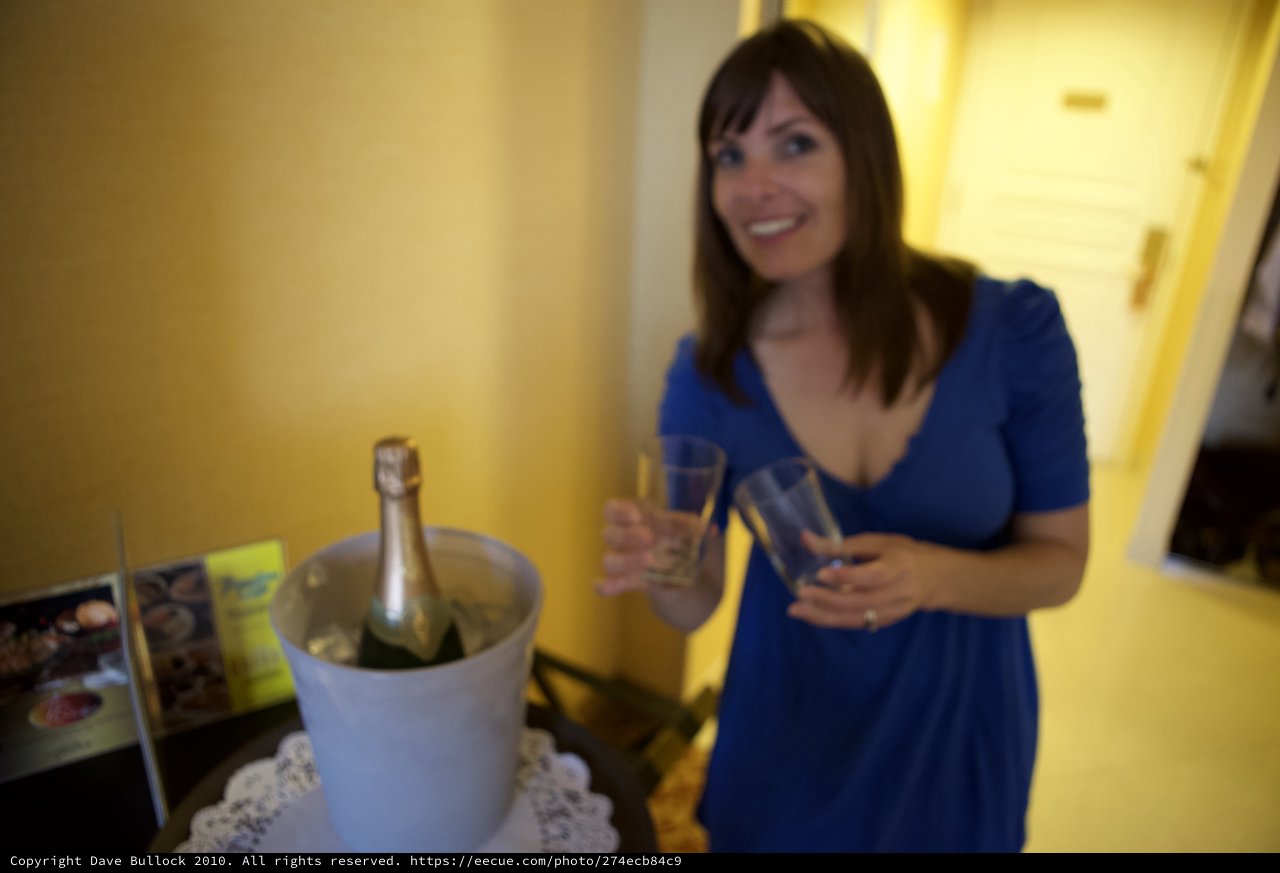Celebrating with Champagne in a Hotel Room