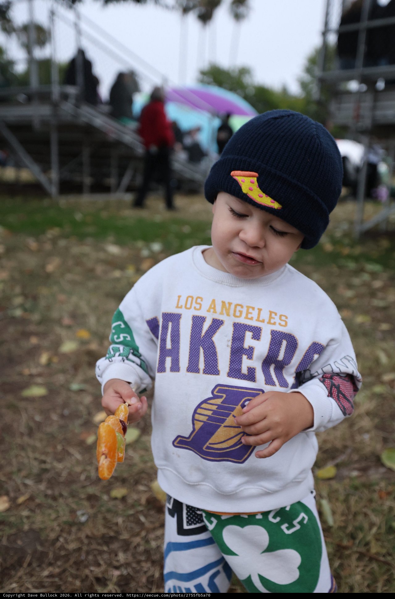 Young Lakers Fan Snacking at Outdoor Festival