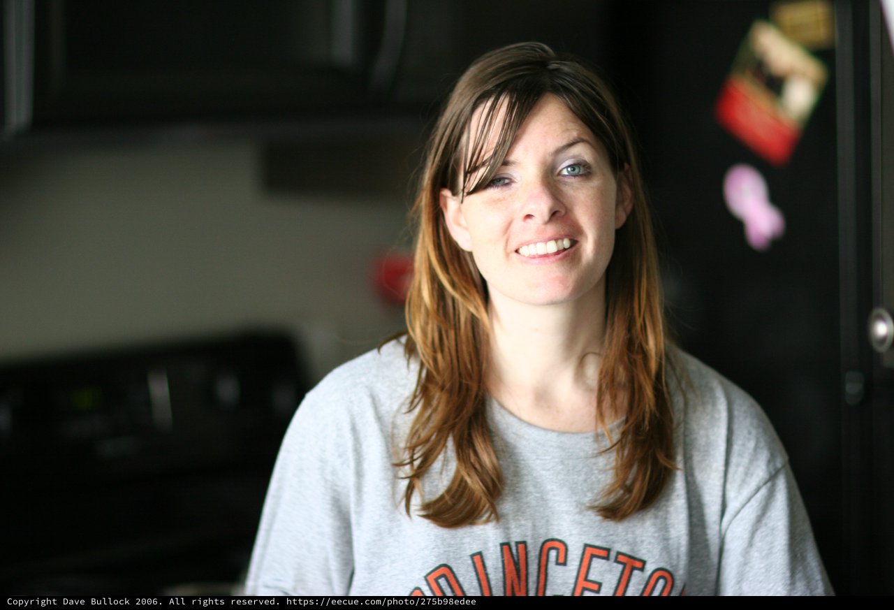 Candid Kitchen Portrait of Smiling Young Woman