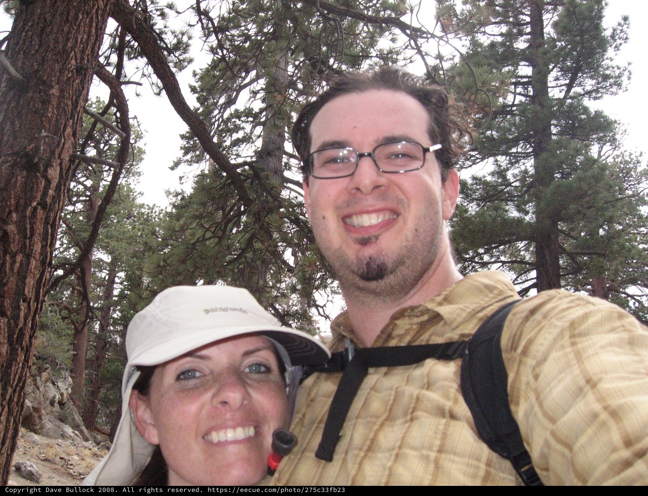 Couple Smiling During Mountain Hiking Adventure