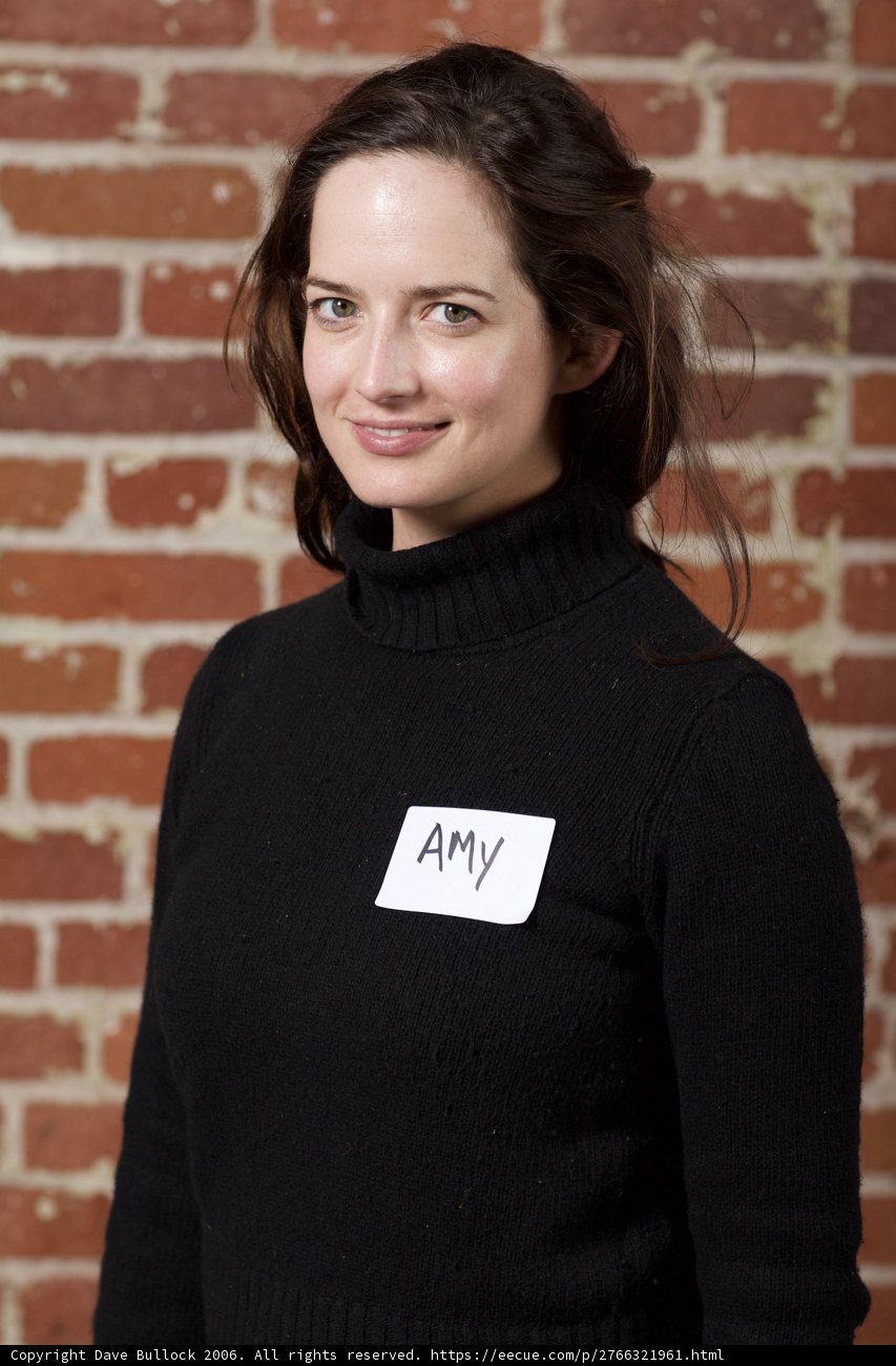 Black Sweater and a Brick Wall