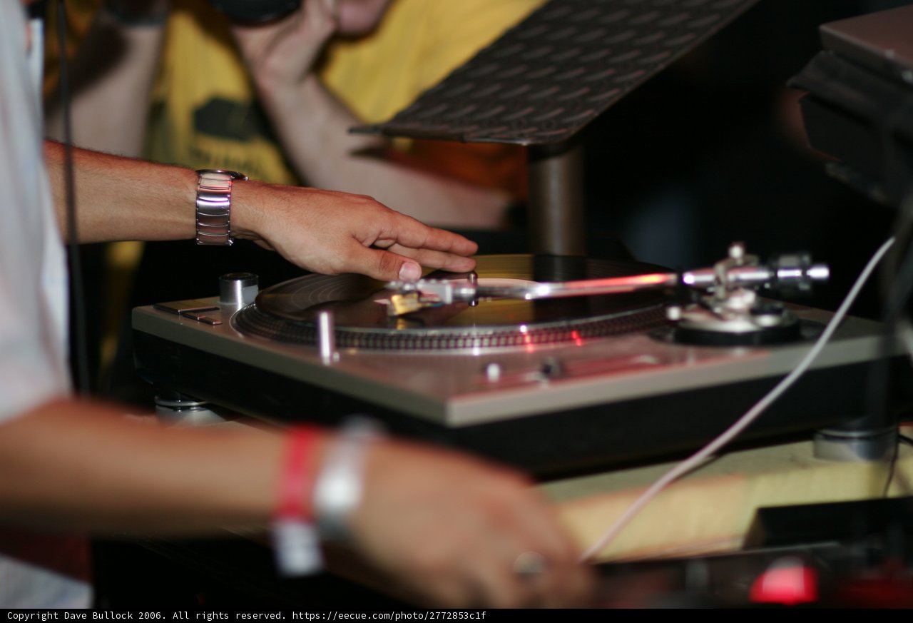 DJ spinning tunes on turntable