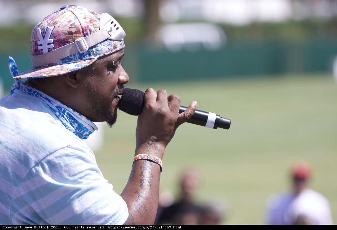 Man with Mic in Hat Performs at Coachella
