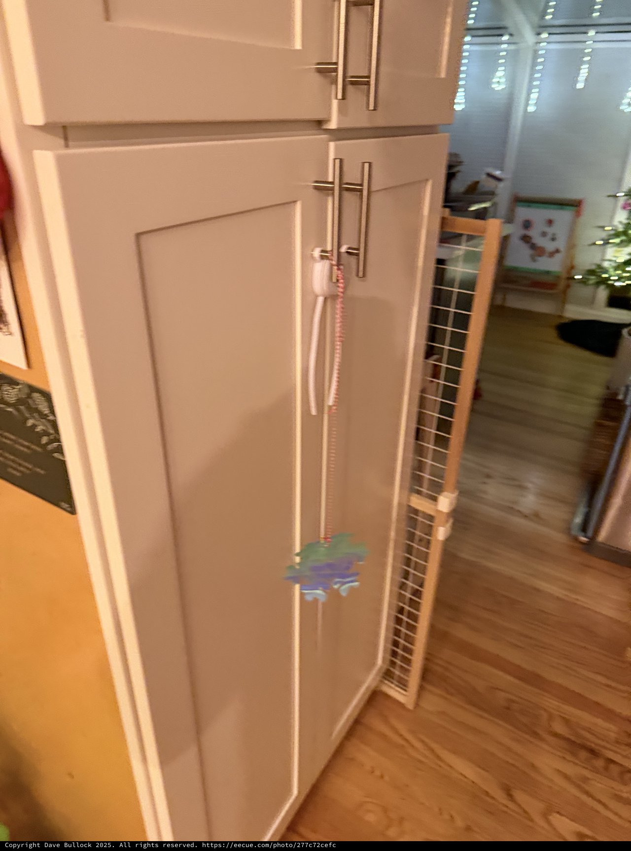 White Kitchen Cabinets with Safety Gate Installation