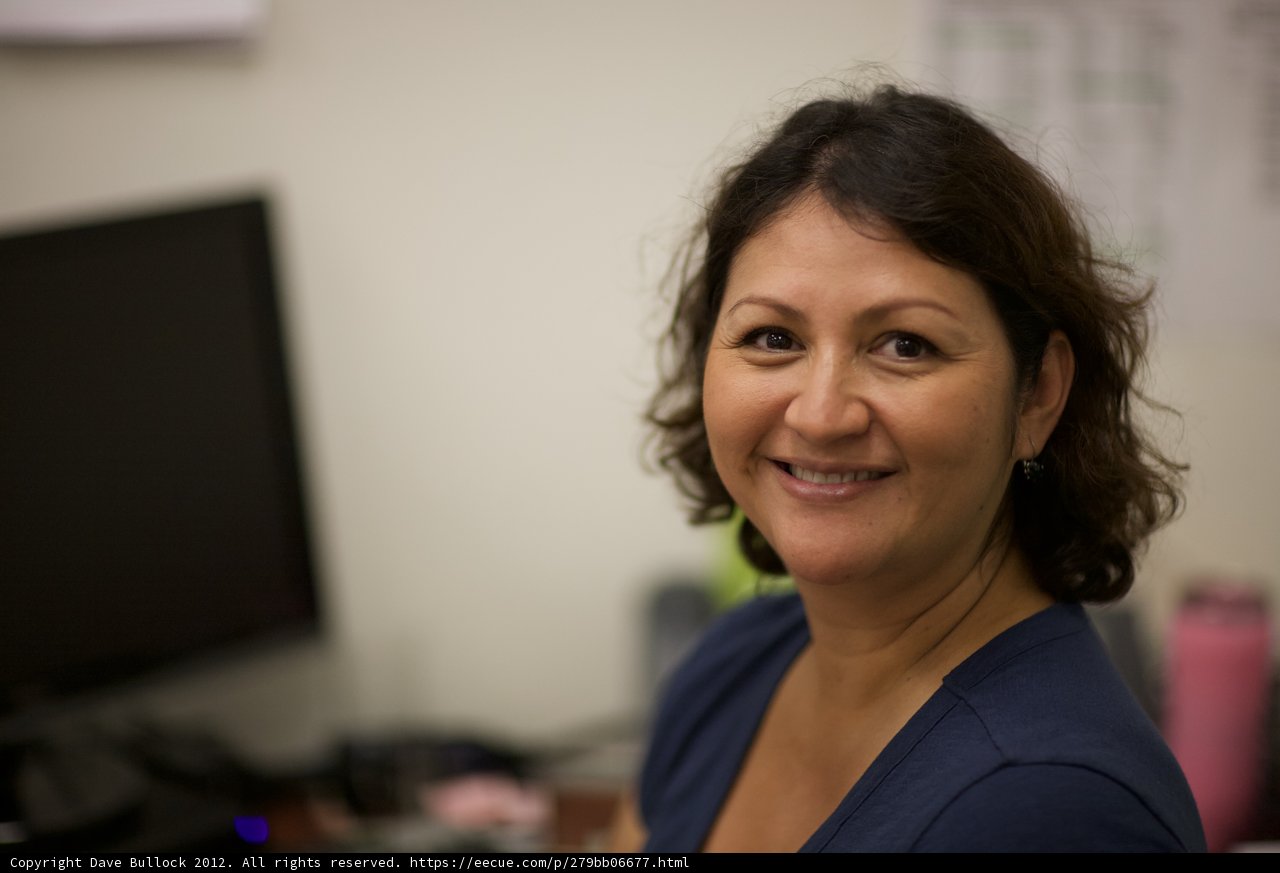 A Happy Woman at her Computer Screen