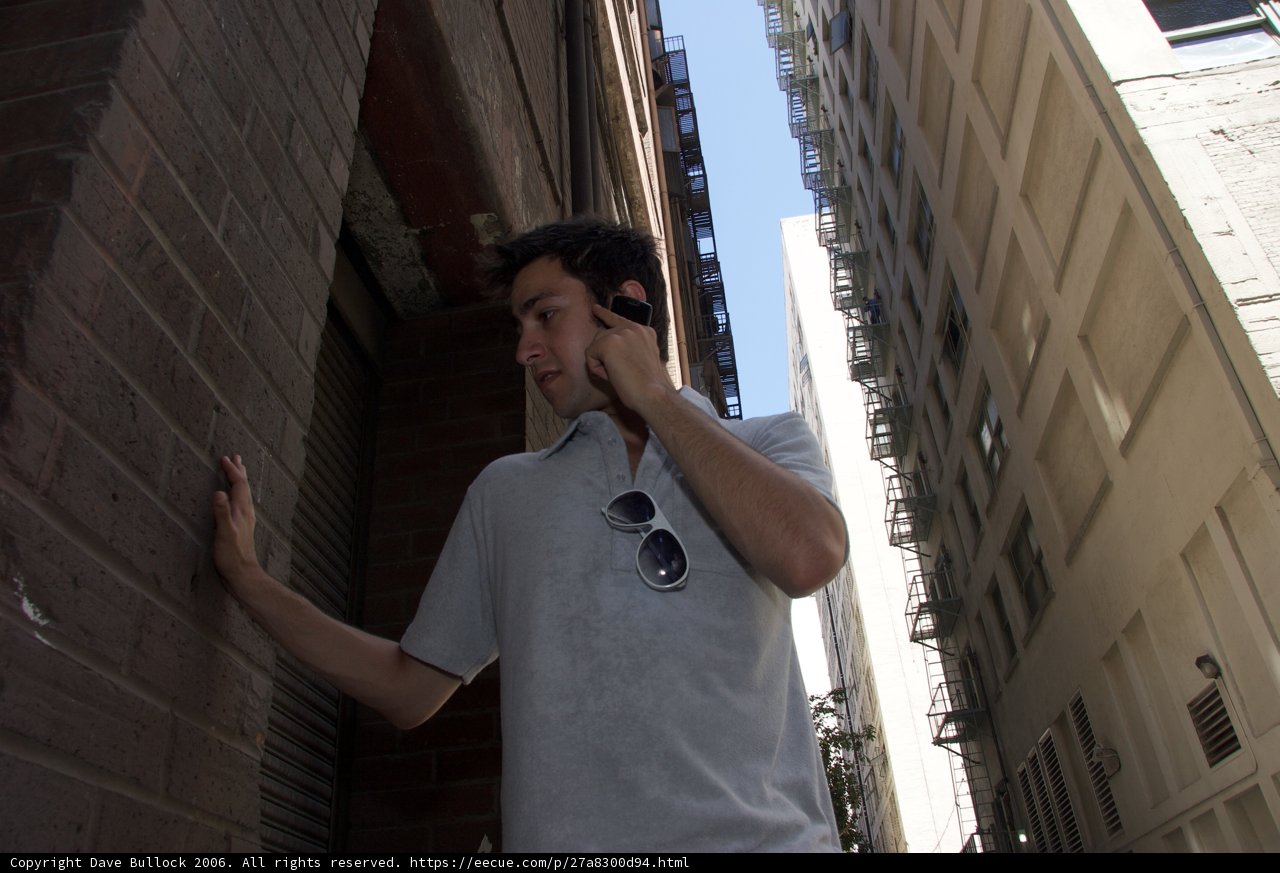Cell Phone Conversation at Urban Building