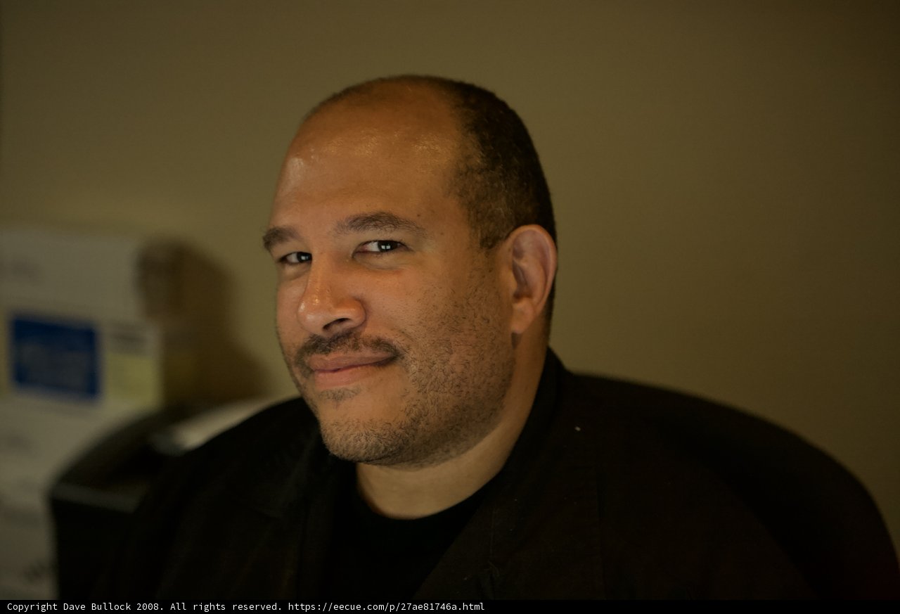 Happy man with black shirt and moustache