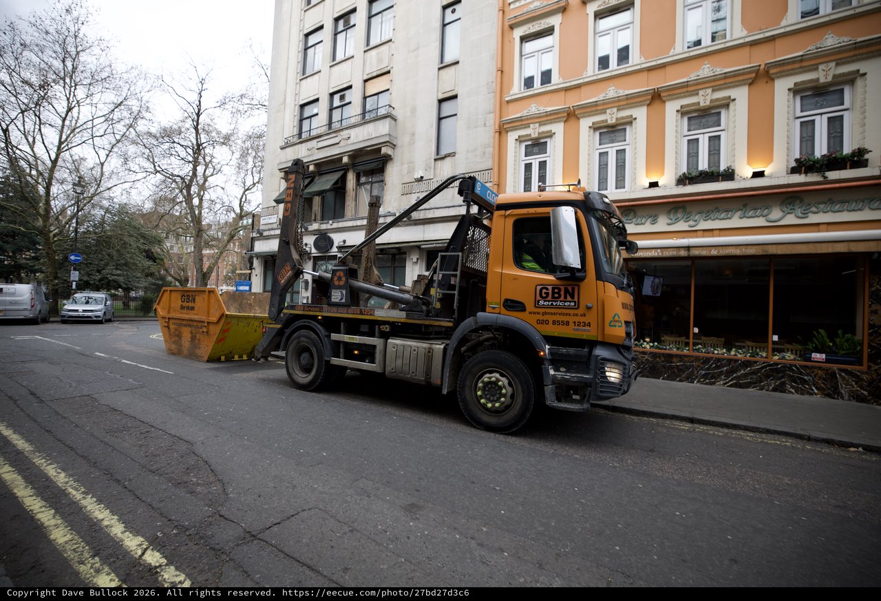 Skip Hire Truck Servicing Urban London Street