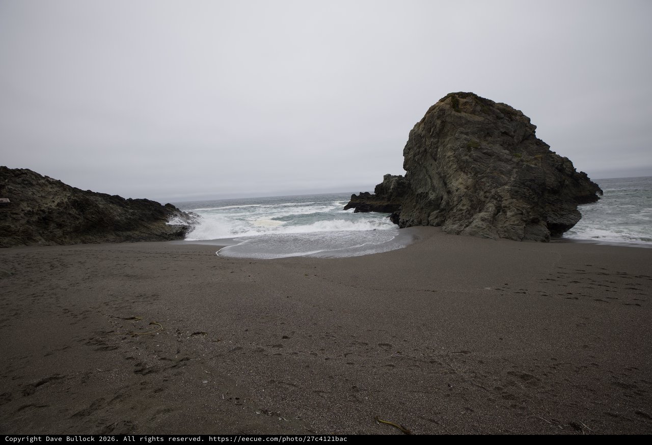 Moody Coastal Cove with Dramatic Sea Stack