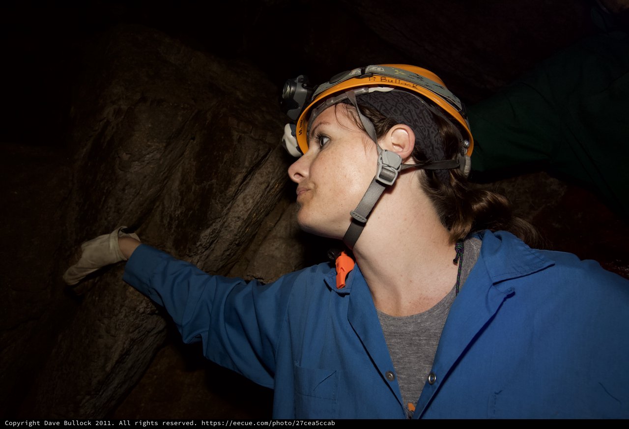 Spelunker Explores Dark Cave Passages Underground