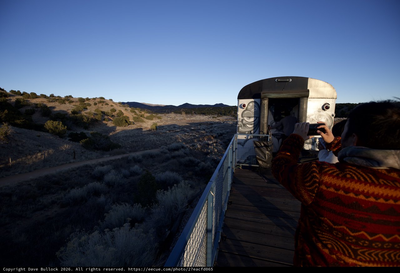 Desert Sunset at Futuristic Observation Platform with Face Sculpture
