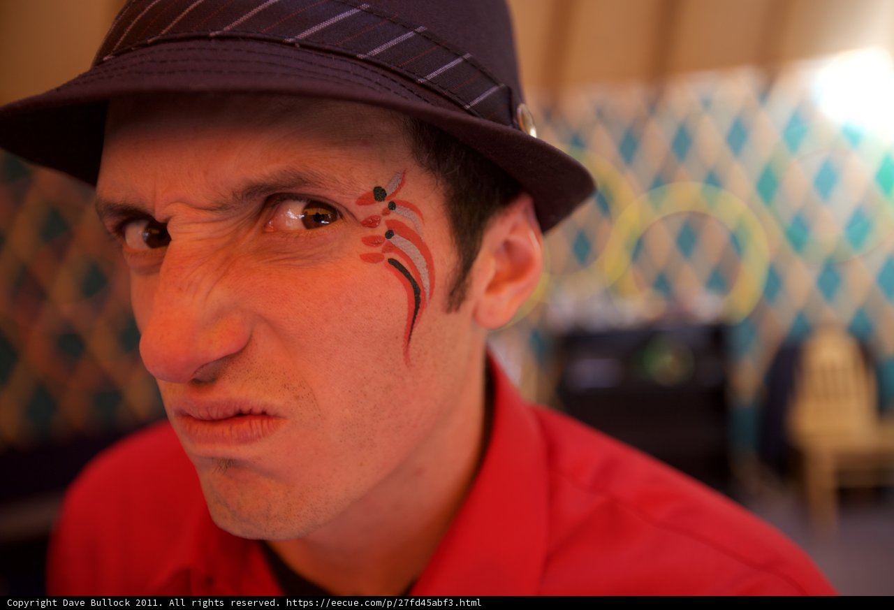 Face Painted Man in a Sun Hat