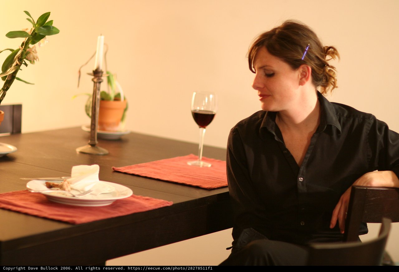 Quiet Reflection at a Candlelit Dinner Table
