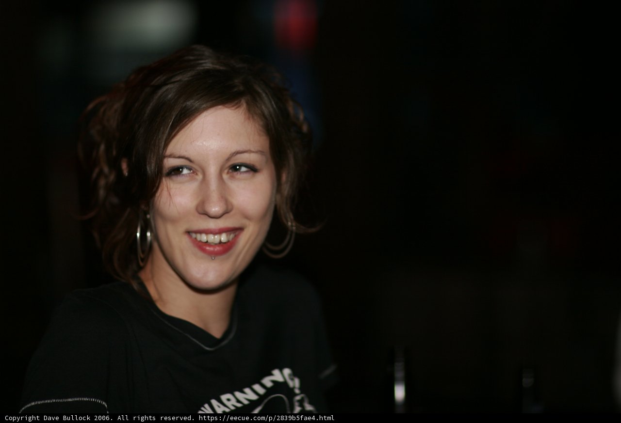 Happy Woman in T-Shirt and Earrings