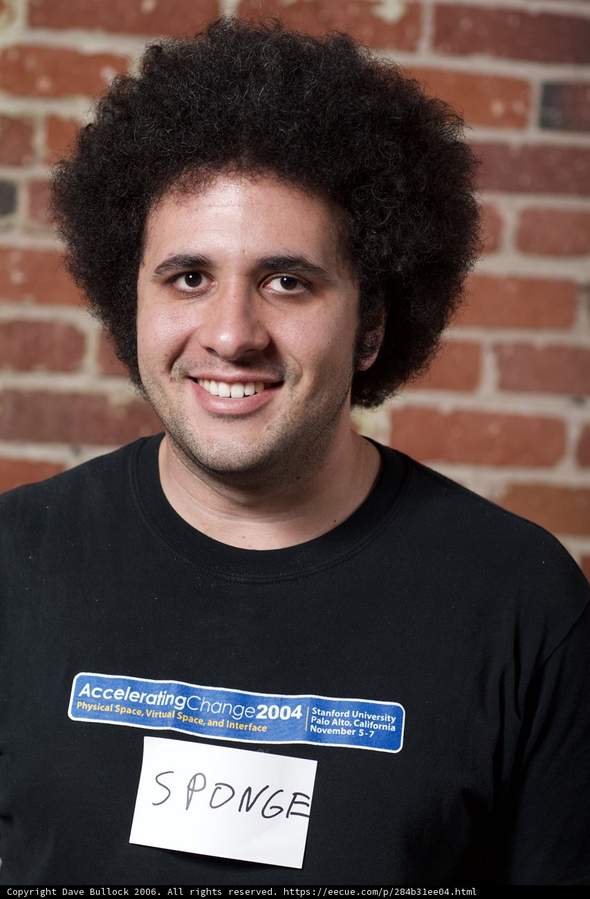 A Smiling Man in Black T-Shirt