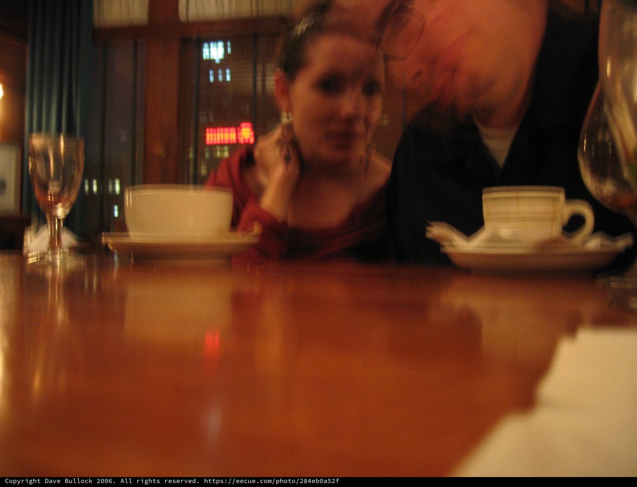 Intimate Couple Sharing a Quiet Café Moment