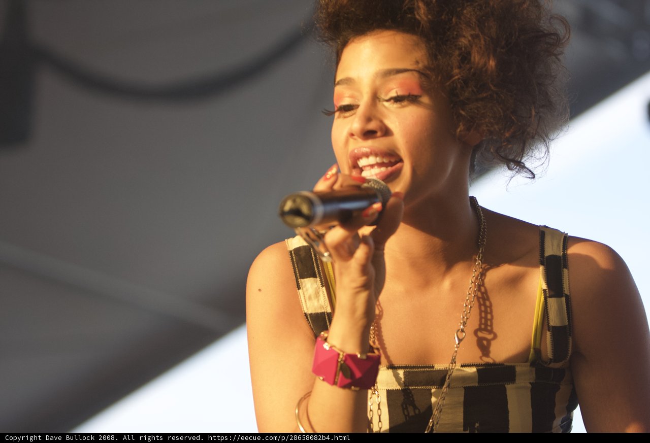 Curly-haired Woman serenade the Crowd at Coachella