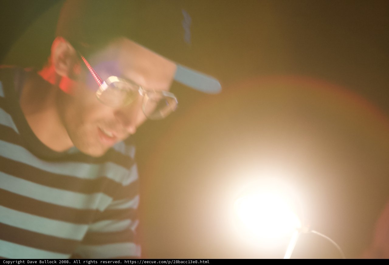 Striped and Speckled: A Portrait of a Man in Glasses