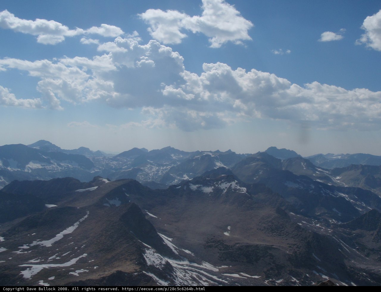 Majestic Peak Amidst the Cumulus Clouds