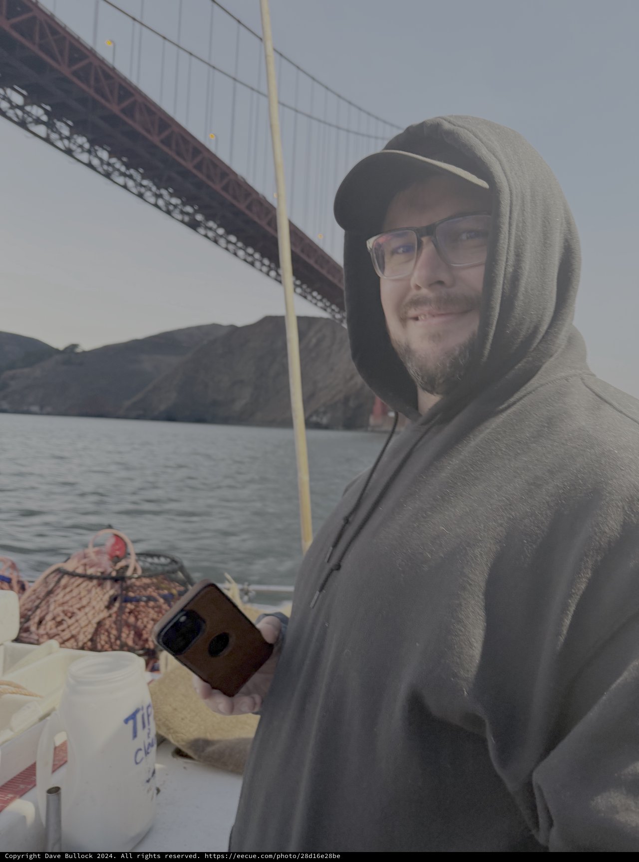 Man on Boat Trip Near Famous Bridge