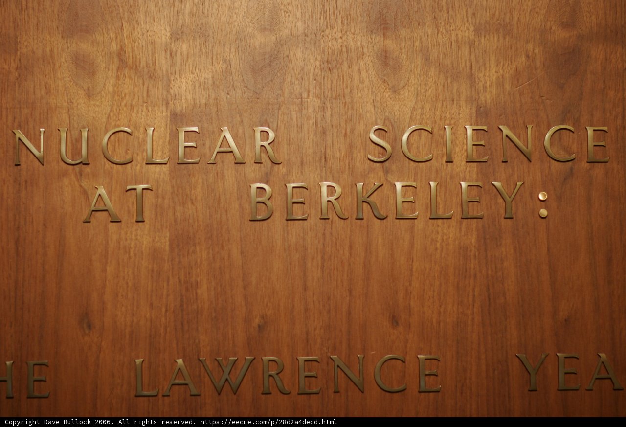 Engraved Nuclear Science Plaque on Stained Wood Door