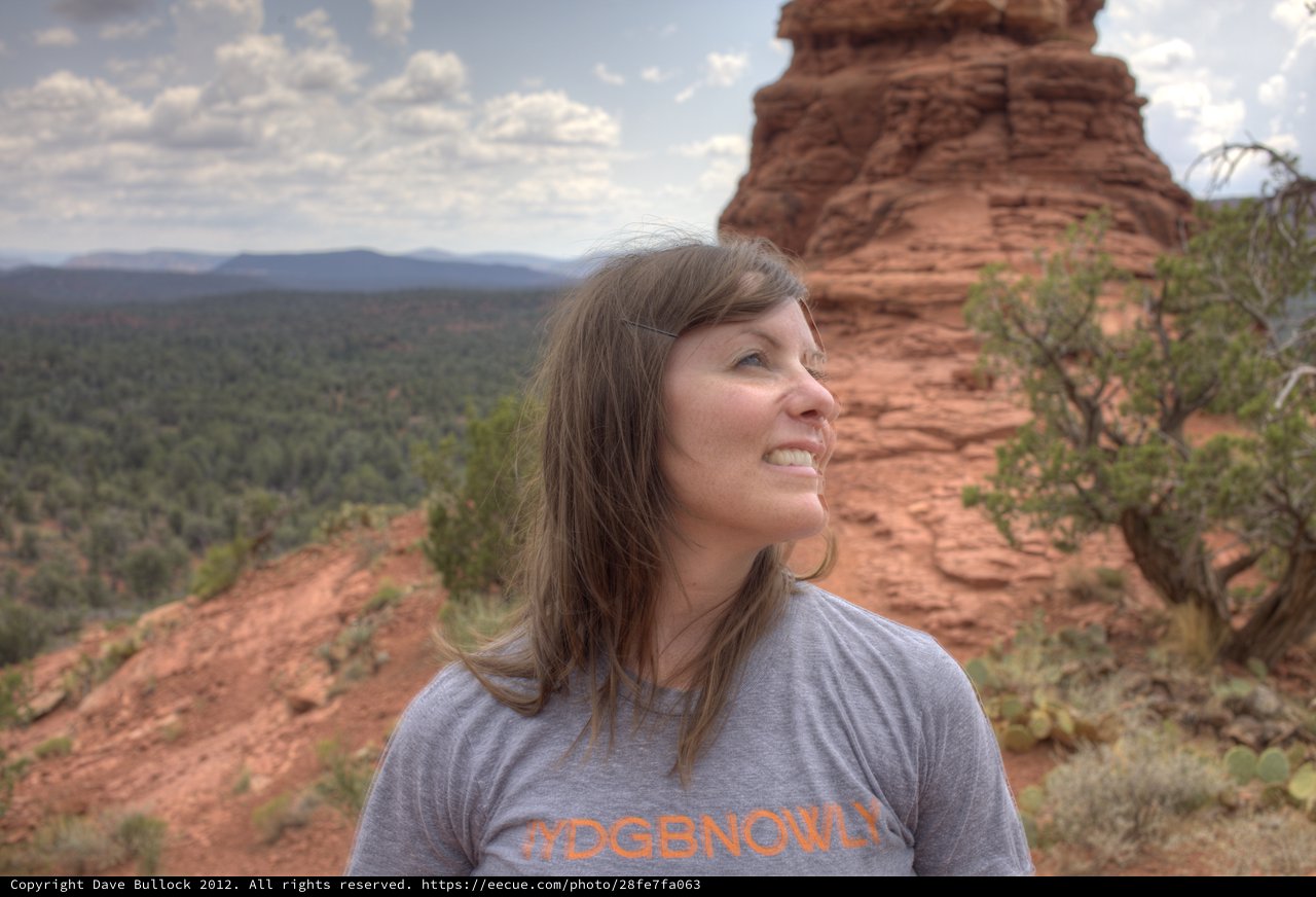 Woman Smiling Amid Sedona's Red Rock Formations