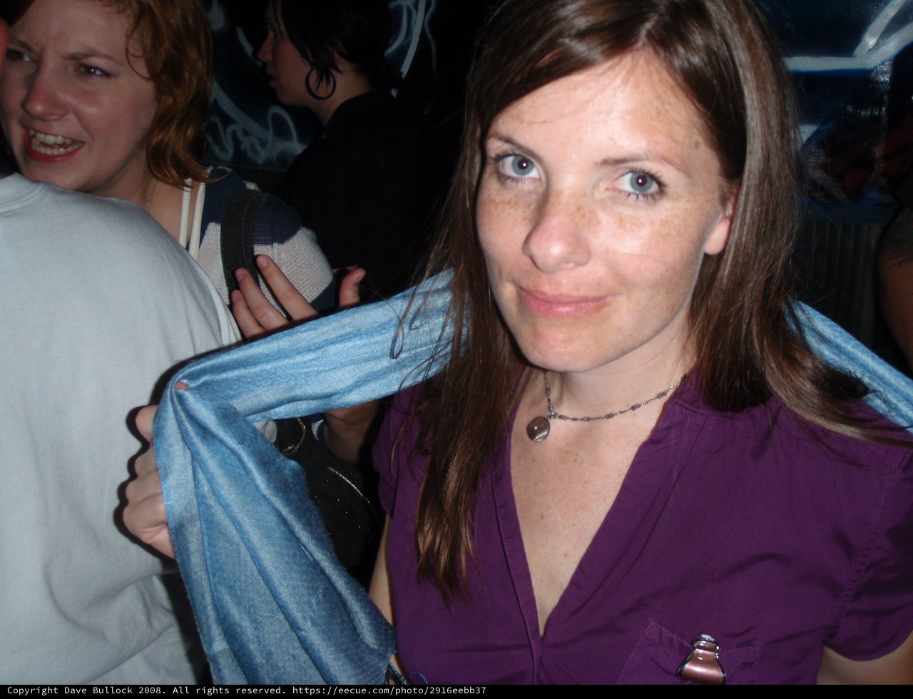 Two Women Socializing at a Nightclub Event