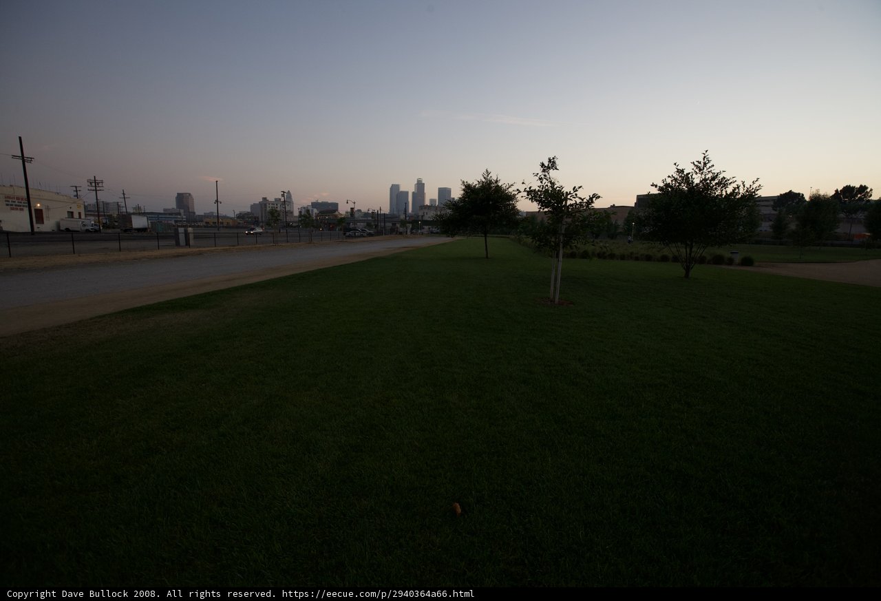 Cityscape over Grassy Field