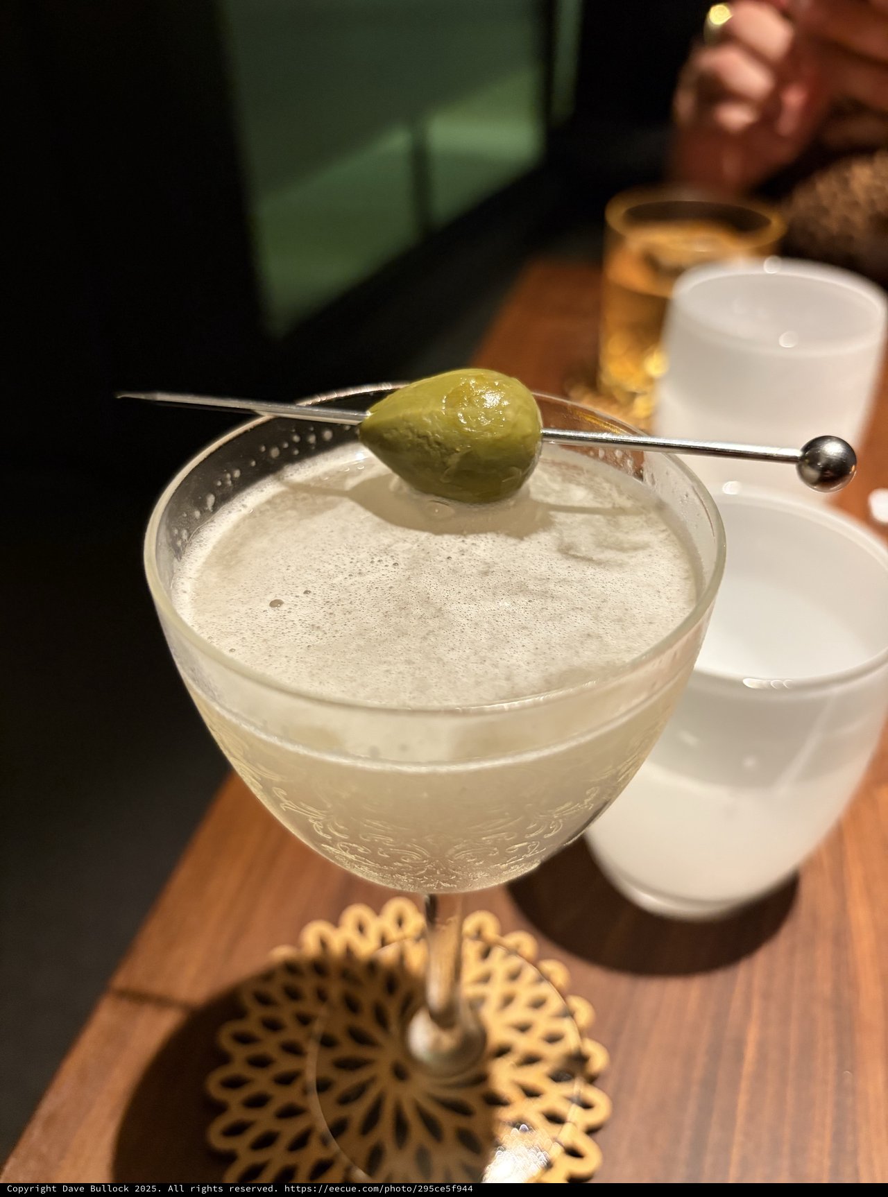 Elegant Martini with Olive Garnish at Upscale Bar