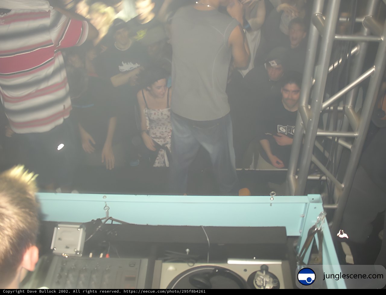 Underground Rave Scene with DJ and Crowd