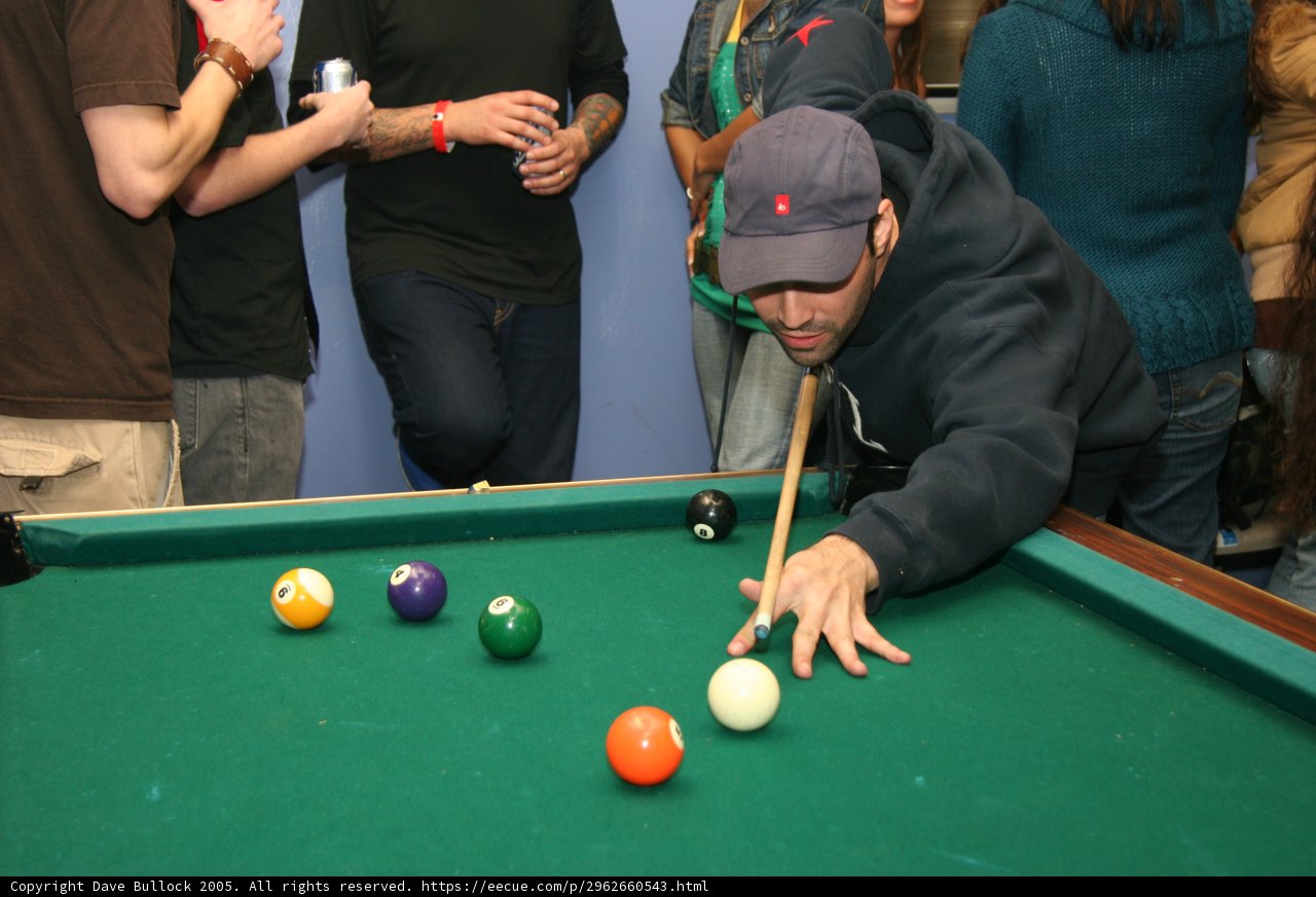 Blue Shirted Man in the Billiard Room